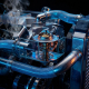 Cross-section of automotive engine cooling system showing blue coolant flowing through metal passages and radiator tubes with central thermostat component.