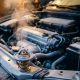 Car engine bay with frost-covered surfaces and exhaust vapor, featuring a closed thermostat component in foreground during cold winter morning