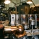 Precision engine block cutaway revealing stress fractures and thermal damage on metal components with thermostat housing in foreground