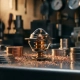 Precision-machined thermostat component cross-section on polished metal workbench, surrounded by copper shavings and heat-conducting alloy discs, warm amber glow at core.