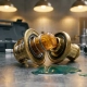 Cross-section of an automotive thermostat with expanded wax element inside brass housing, coolant pool on steel workshop surface.